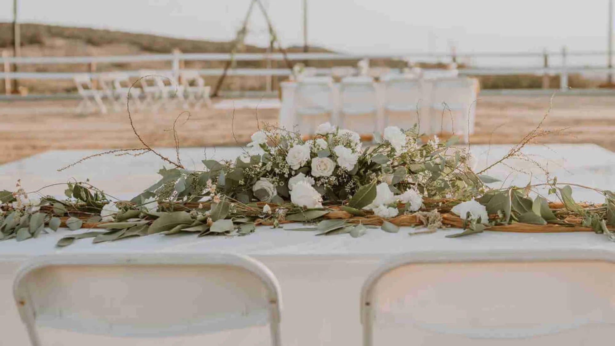 Rustic ranch wedding setting with rolling hills
