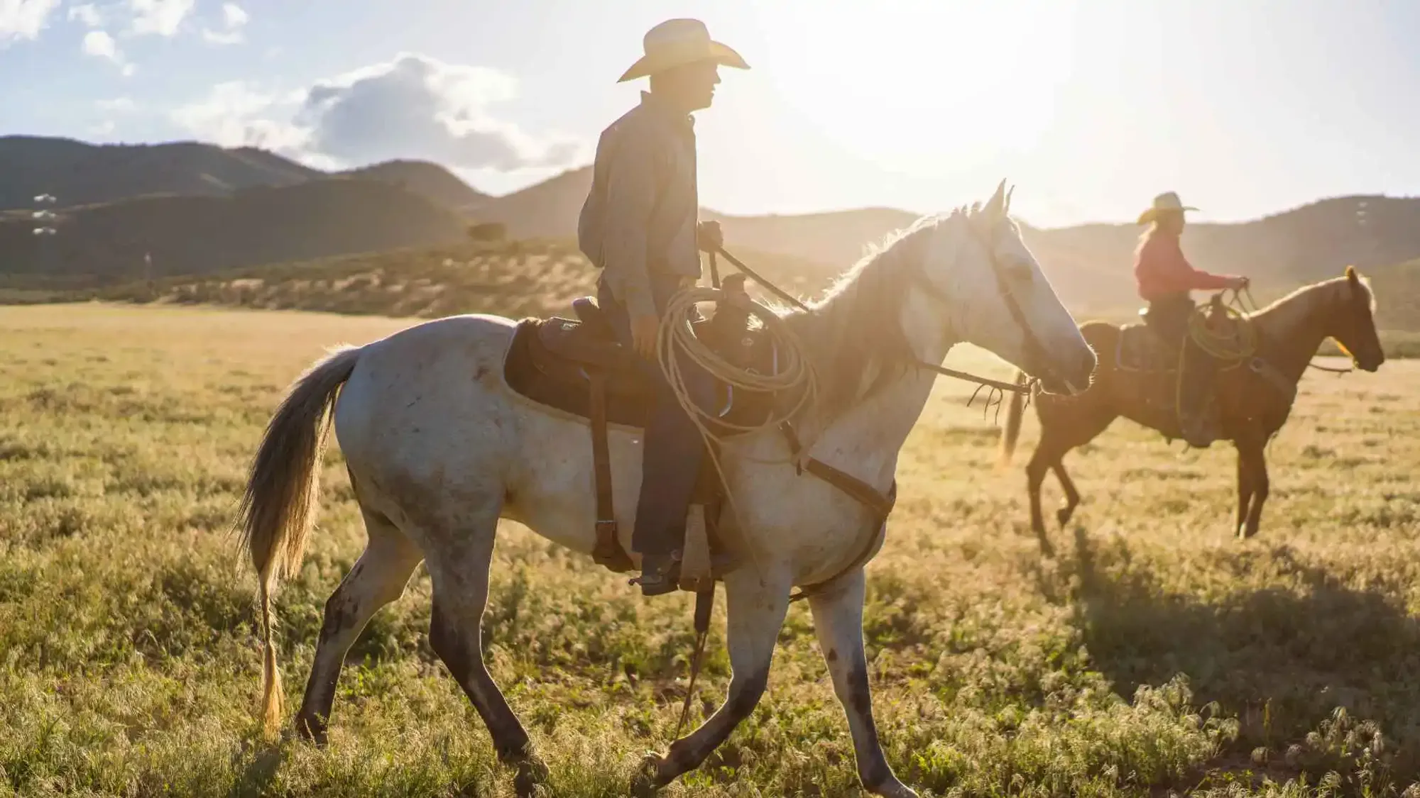 Guests riding horses at a dude ranch in San Diego